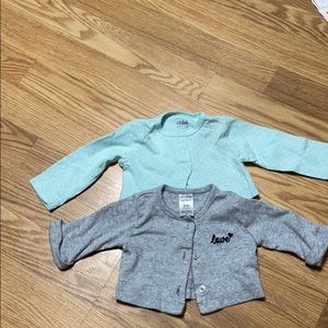 Baby sweaters button up. 2